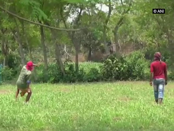 An unidentified man hurls crude bomb in Murshidabad, West Bengal, on Tuesday. Photo/ANI