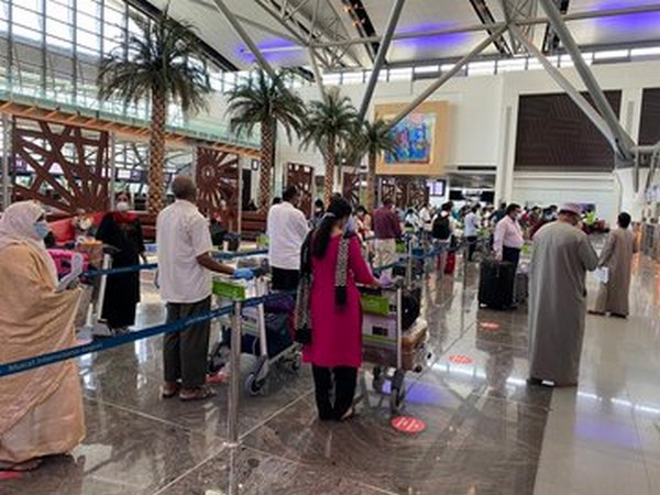 Indian nationals queue at Muscat Airport to board third Air India Express flight for Trivandrum