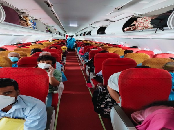 Stranded Indian nationals on board Air Indian flight 908 Muscat - Chennai flight from Oman to Chennai on Sunday. Photo/ANI