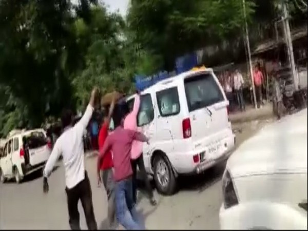 Protesters throw ink at Bihar Chief Minister Nitish Kumar's vehicle. Photo/ANI