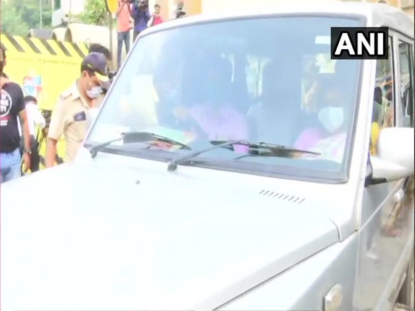 NCB team at actor Rhea Chakraborty's home in Mumbai on Sunday. (Photo/ANI)