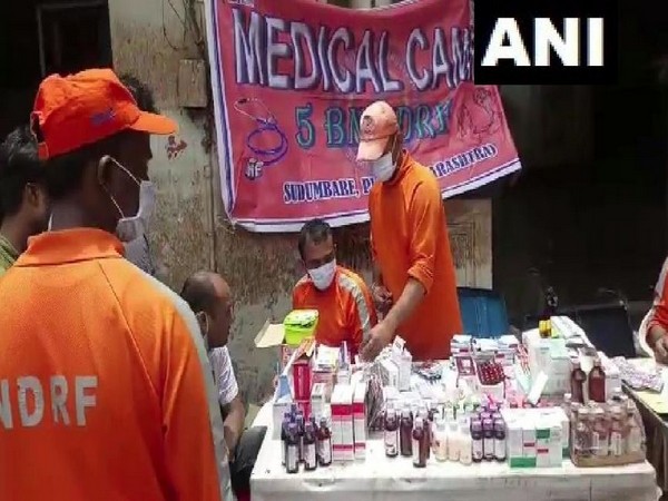 NDRF personnel attending to people in need of medical attention in Sangli on Tuesday. Photo/ANI