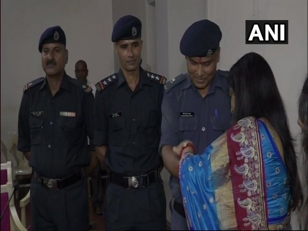 Vadodara District Collector Shalini Agarwal tied rakhi on the wrists of NDRF personnel.
