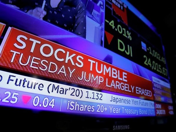 Stock market updates are seen on a news broadcast on the floor of the New York Stock Exchange (NYSE)
