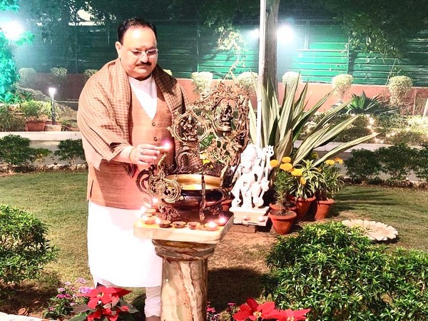 BJP president JP Nadda lighting a lamp at his residence in New Delhi on Saturday. Photo/ANI