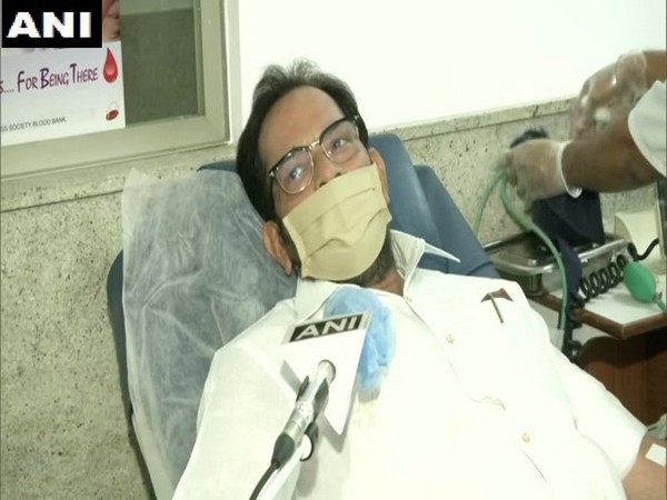 Union Minister Mukhtar Abbas Naqvi while donating blood in New Delhi on Sunday. Photo/ANI
