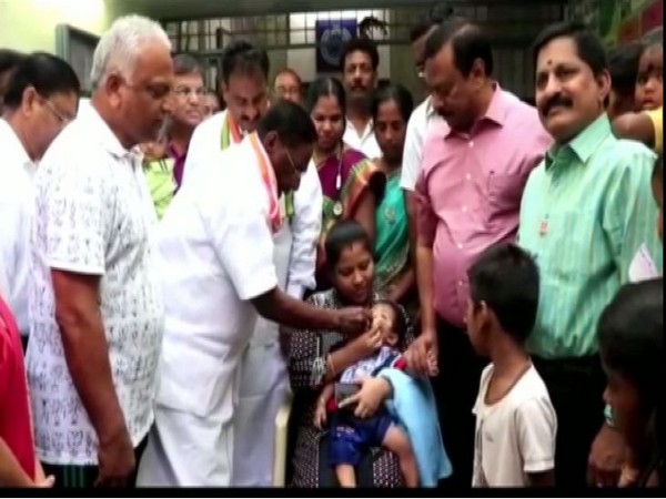 Puducherry Chief Minister V Narayanasamy giving polio drops to a child on Sunday. Photo/ANI