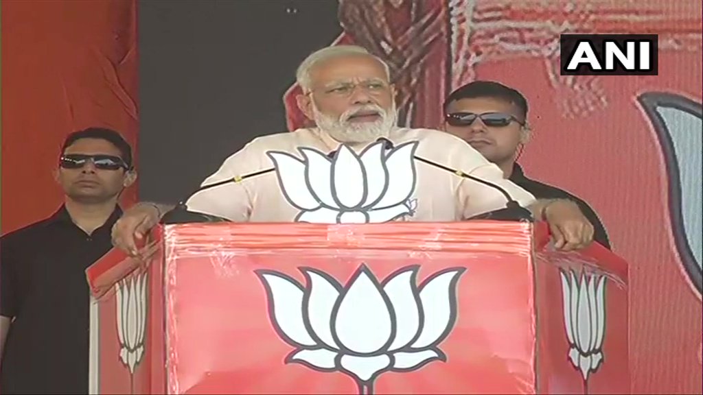 Prime Minister Narendra Modi addresses a public rally in Rajahmundry on Monday.