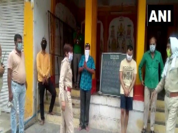 People who attended the prayer at Narsingh Temple in Indore being detained by police. Photo/ANI