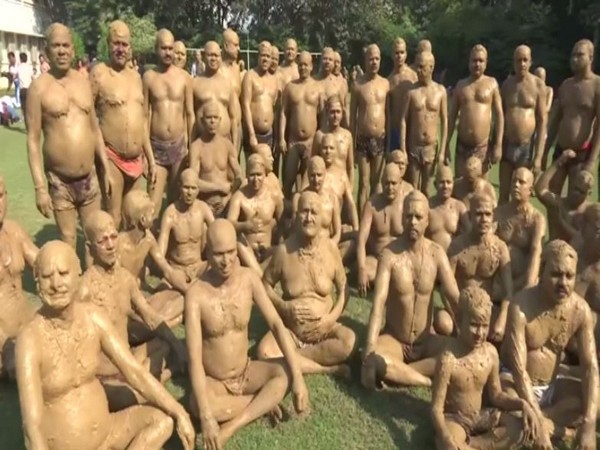 A record number of people coated themselves with natural clay in Gorakhpur on Monday.