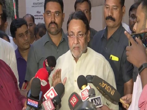 NCP leader Nawab Malik speaking to reporters in Mumbai on Sunday. Photo/ANI