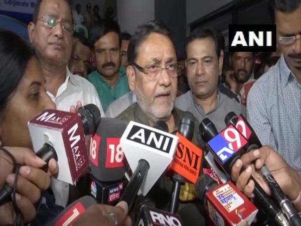 NCP leader Nawab Malik talking to media persons after the party meeting in Mumbai on Saturday evening.