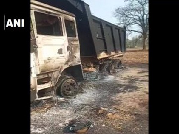 Naxals set fire to 7 vehicles engaged in road work .