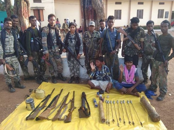 DRG personnel with the two Naxals and the arms that were seized after the exchange of fire on Monday. Photo/ANI