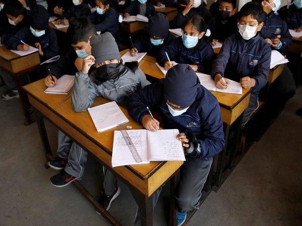 Children wearing facial masks, as a precaution after Nepal