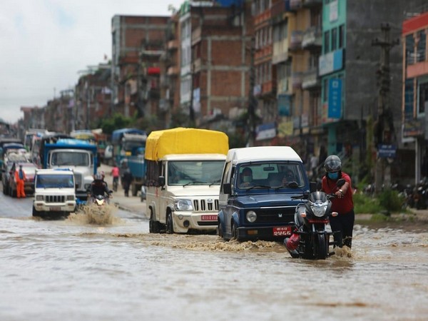 Vehicles struggle to get through a undaunted road section in Kavrepalanchok District of Nepal on July 9th, 2021. (ANI)