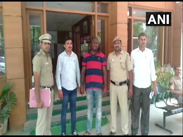 Visuals of police officer with the arrested accused in New Delhi.