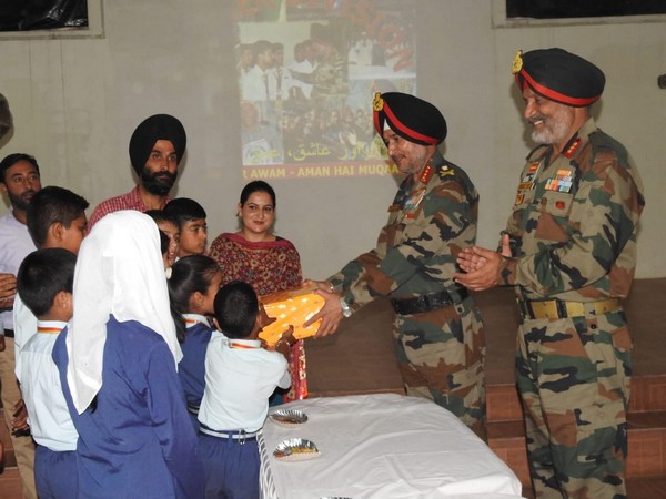 Lt Gen Ranbir Singh, General Officer Commanding-in-Chief of Northern Command interacting with kids in North Kashmir on Tuesday. (Photo/ANI)