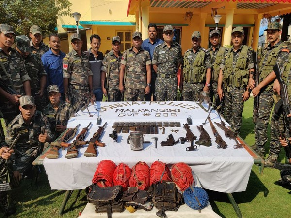 Security forces with arms and ammunition seized from Naxals