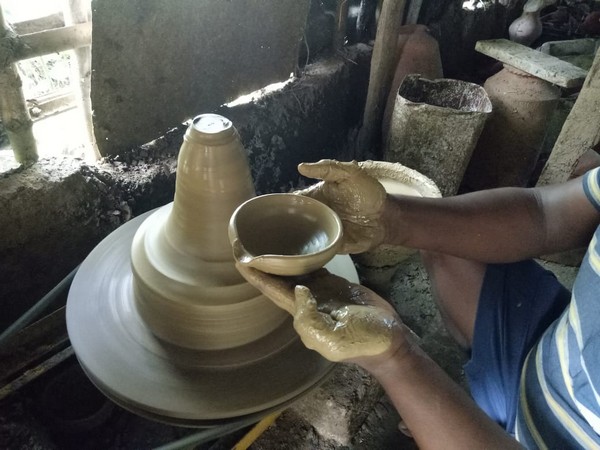 Potter makes earthen lamp in Odisha ahead of Diwali. Photo/ANI