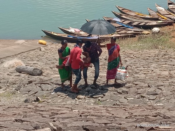 BSF personnel assisted an unconscious woman, who later gave birth in the ambulance on Saturday. (Photo: BSF) 