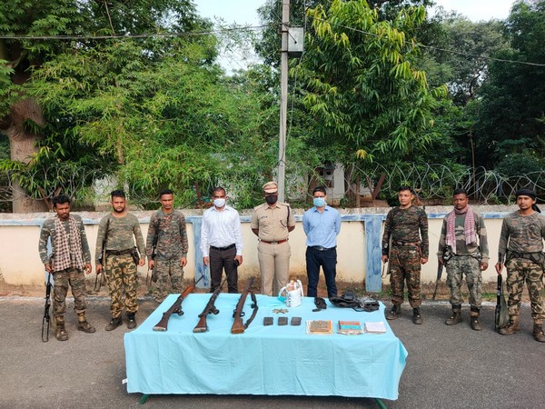 Security forces displaying the recovered arms and ammunition in a joint operation on Wednesday. (Photo/ANI)