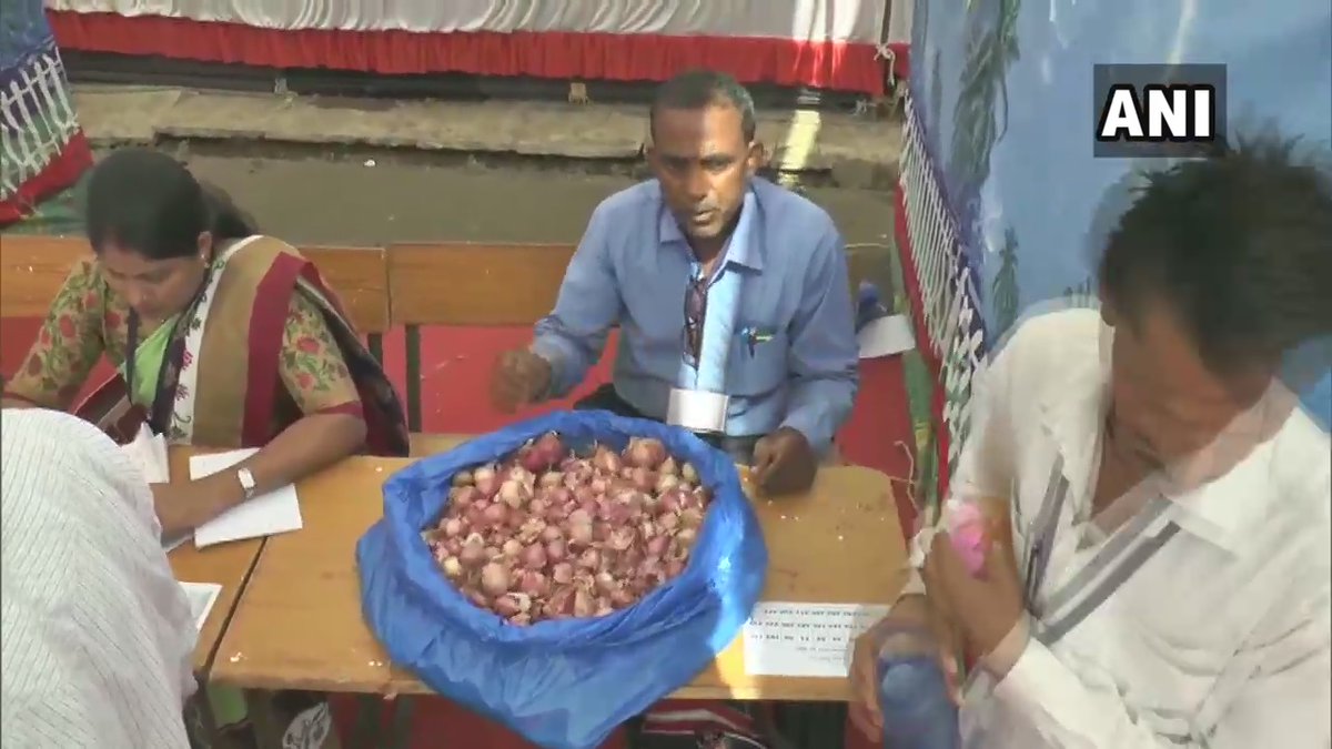 Heap of onion with the poll officials.