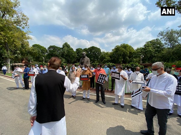 Opposition MPs protesting at the Parliament premises on Wednesday. Photo/ANI
