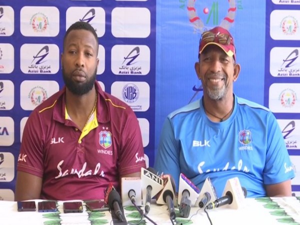 West Indies skipper Kieron Pollard (L) and coach Floyd Reifer (R)