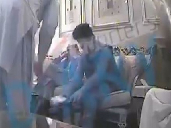 A video grab of a couple of PTI MNAs taking money from Mohammad Ali Bacha, former MPA of the PPP before the Senate elections 2018. (Twitter/PTI)