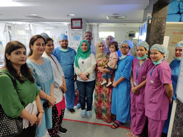 A team of doctors with the minor patient and her familong along with staff of an NGO. 