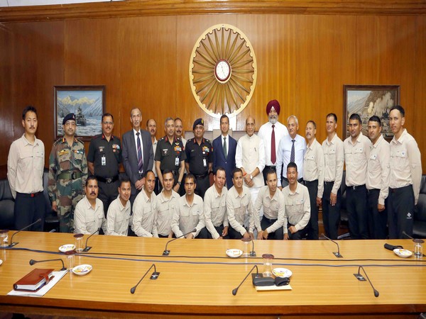 Defence Minister Rajnath Singh interacts with Tiranga Mountain Rescue team in New Delhi. (Photo/ANI)