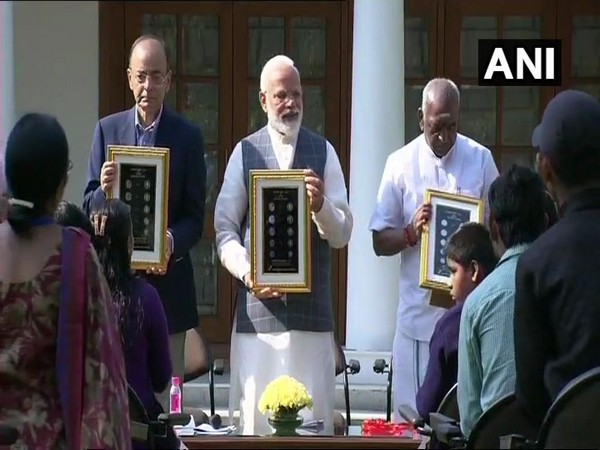 Prime Minister Narendra Modi, Finance Minister Arun Jaitley and MoS Finance Pon Radhakrishnan releasing visually-impaired friendly series of coins on Thursday.