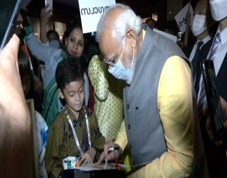 PM Modi interacting with a kid in Tokyo