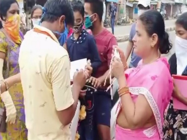 ASHA workers in Etcherla, Andhra Pradesh fine people for not wearing masks on Thursday. (Photo/ANI)