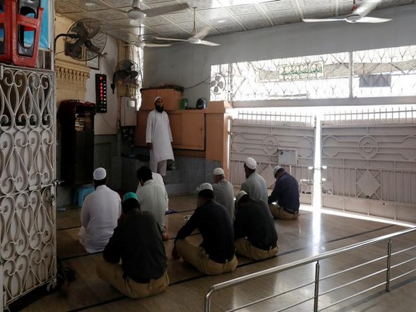 Muslims gather to attend Friday prayers after government limits congregational prayers and ordered people to stay home
