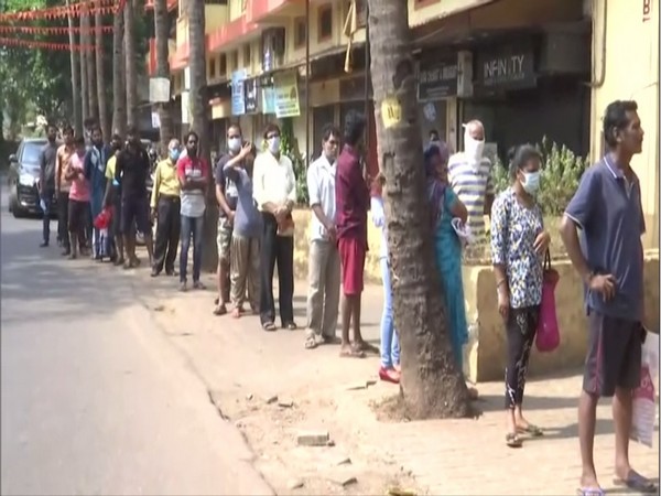 People standing in queue outside a vegetable shop in Panaji. Photo/ANI
