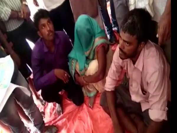 Umesh (L), Rajesh (R) with his wife (M) at the Panchayat. (Photo/ANI)