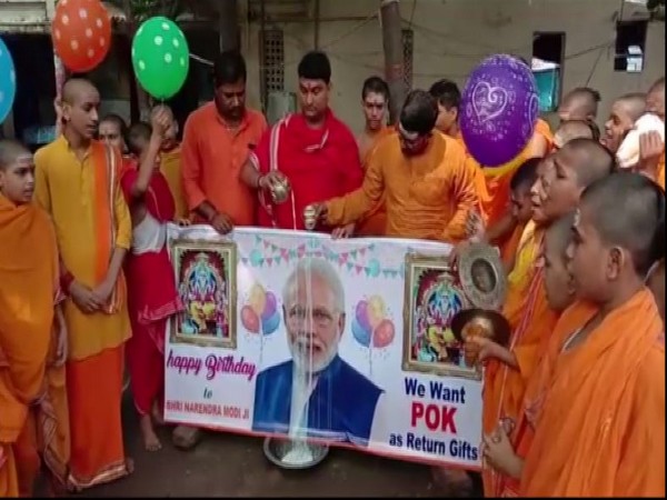 LJP workers offer milk in front of PM Modi poster