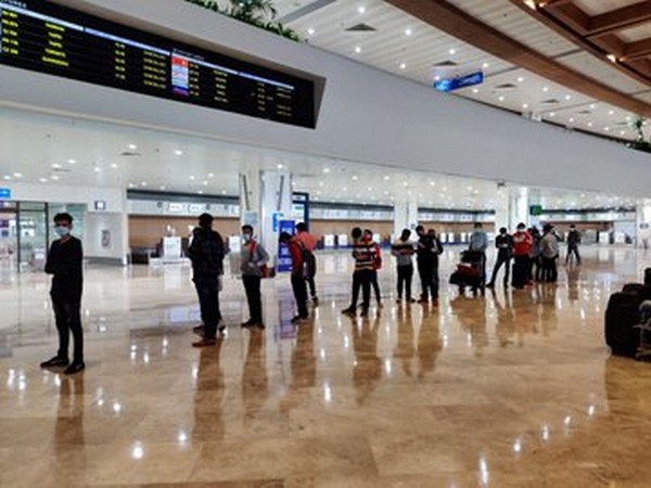 Passengers arrive at Ninoy Aquino International Airport in Manila on Sunday