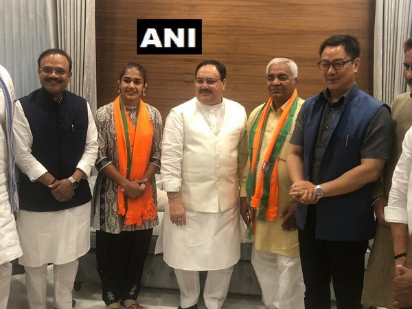 Wrestler Babita Phogat and her father Mahavir Singh Phogat meet BJP Working President JP Nadda