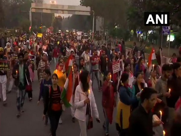 People hold a candlelight vigil in solidarity with the Unnao rape victim in New Delhi on Saturday.