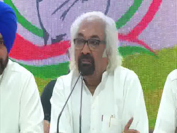 Indian Overseas Congress chief Sam Pitroda talking at a press conference on Monday. Photo/ANI