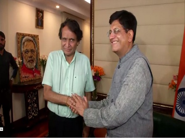 Suresh Prabhu, left, and Union Minister Piyush Goyal, right, at Udyog Bhawan in New Delhi on Friday. Photo/ANI