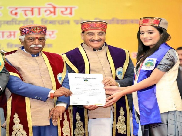 Union Human Resource Development Minister Ramesh Pokhriyal while awarding meritorious students at HP university on Friday. (Photo/ANI)