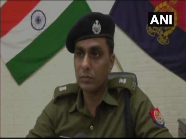 Police officers sharing details of the case lodged against PWD in Kanpur.