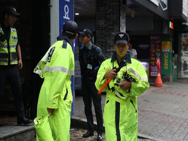 Local authorities secure the area outside the club where the mishap occurred in Gwangju, South Korea on Saturday (Photo/Reuters) 