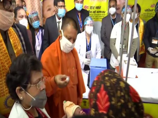 CM Yogi administering polio doses at launch of the event