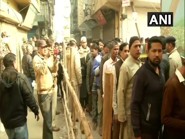 People in queue to exercise their franchise in Delhi on Saturday.