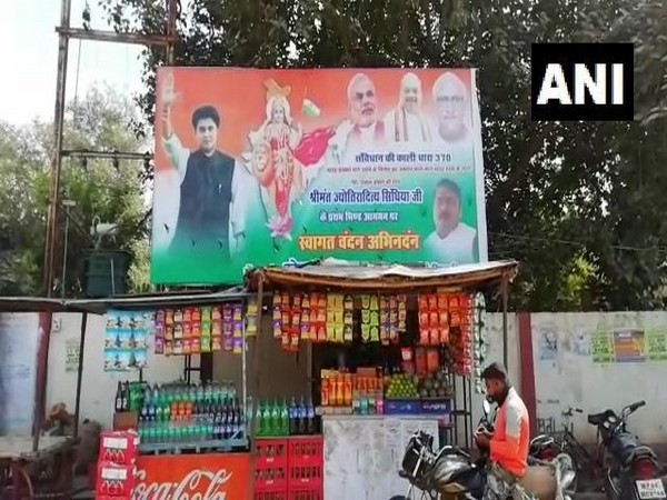 A poster of Congress leader Jyotiraditya Scindia along with PM Narendra Modi and Home Minister Amit Shah in Bhind of Madhya Pradesh on Friday.